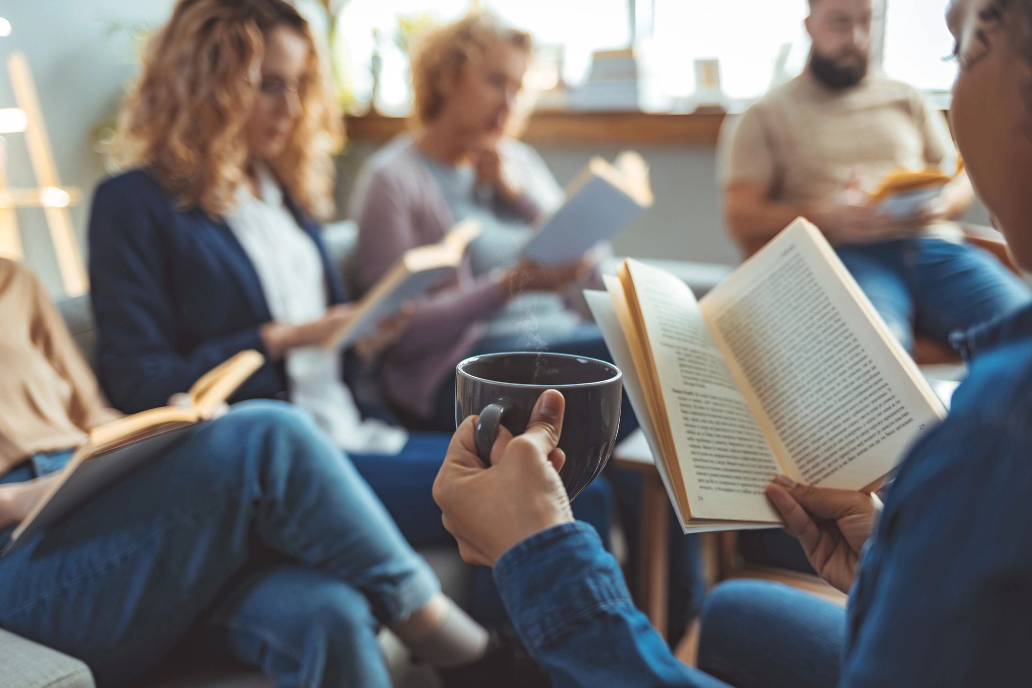 Group of readers sitting with books
