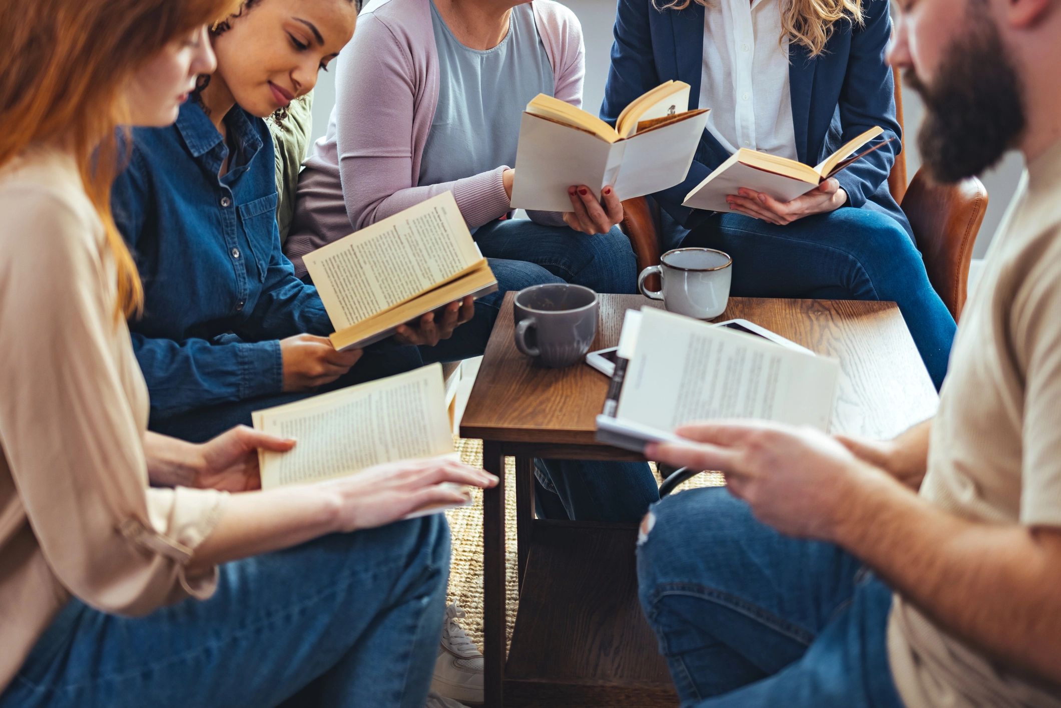 Reader enjoying books in a library setting